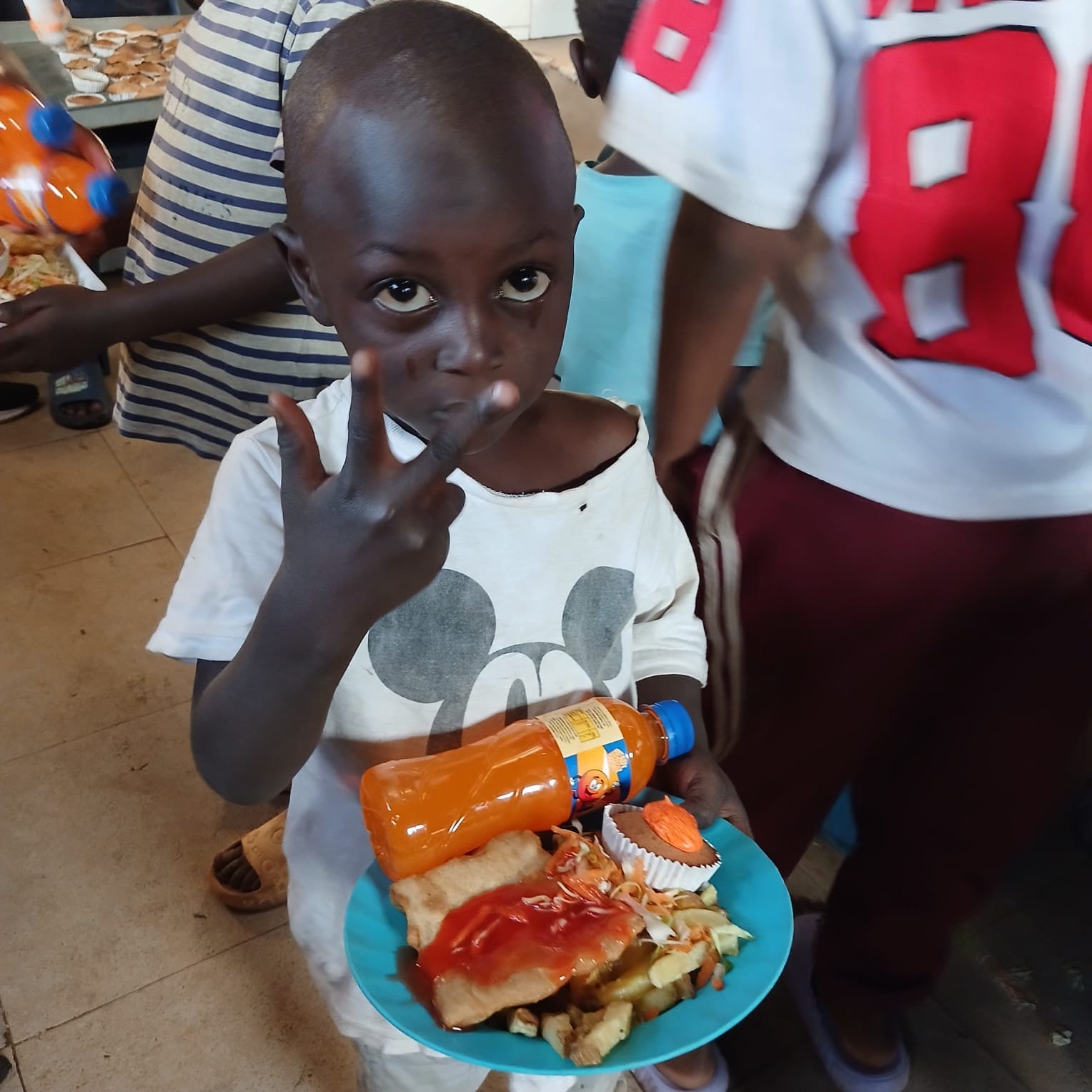 A child with a meal and drink